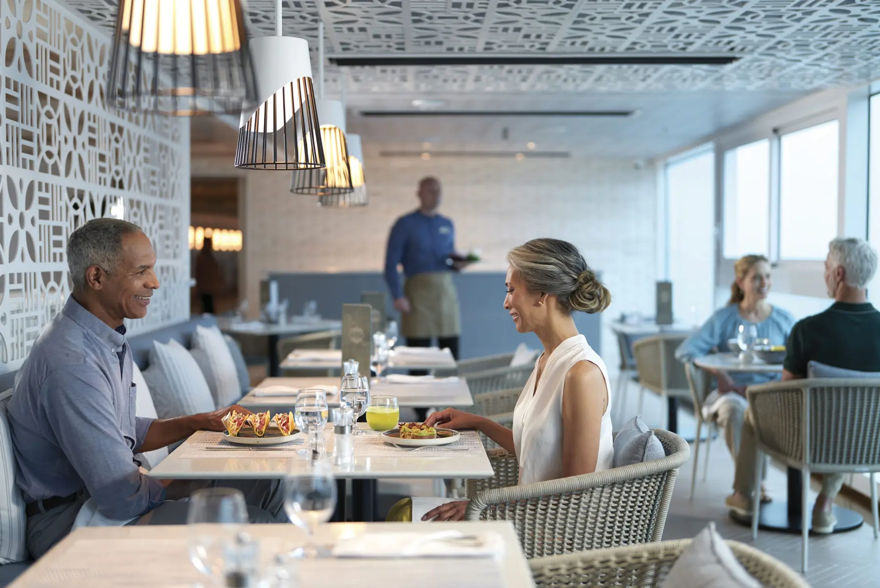 A couple dining together aboard Oceania Allura