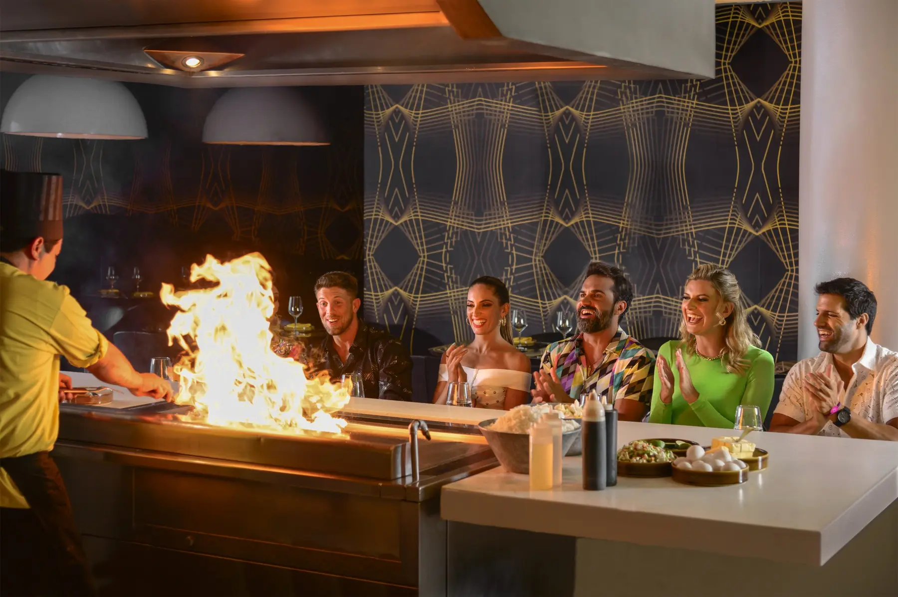 Guests enjoying teppanyaki dining at Sutra restaurant