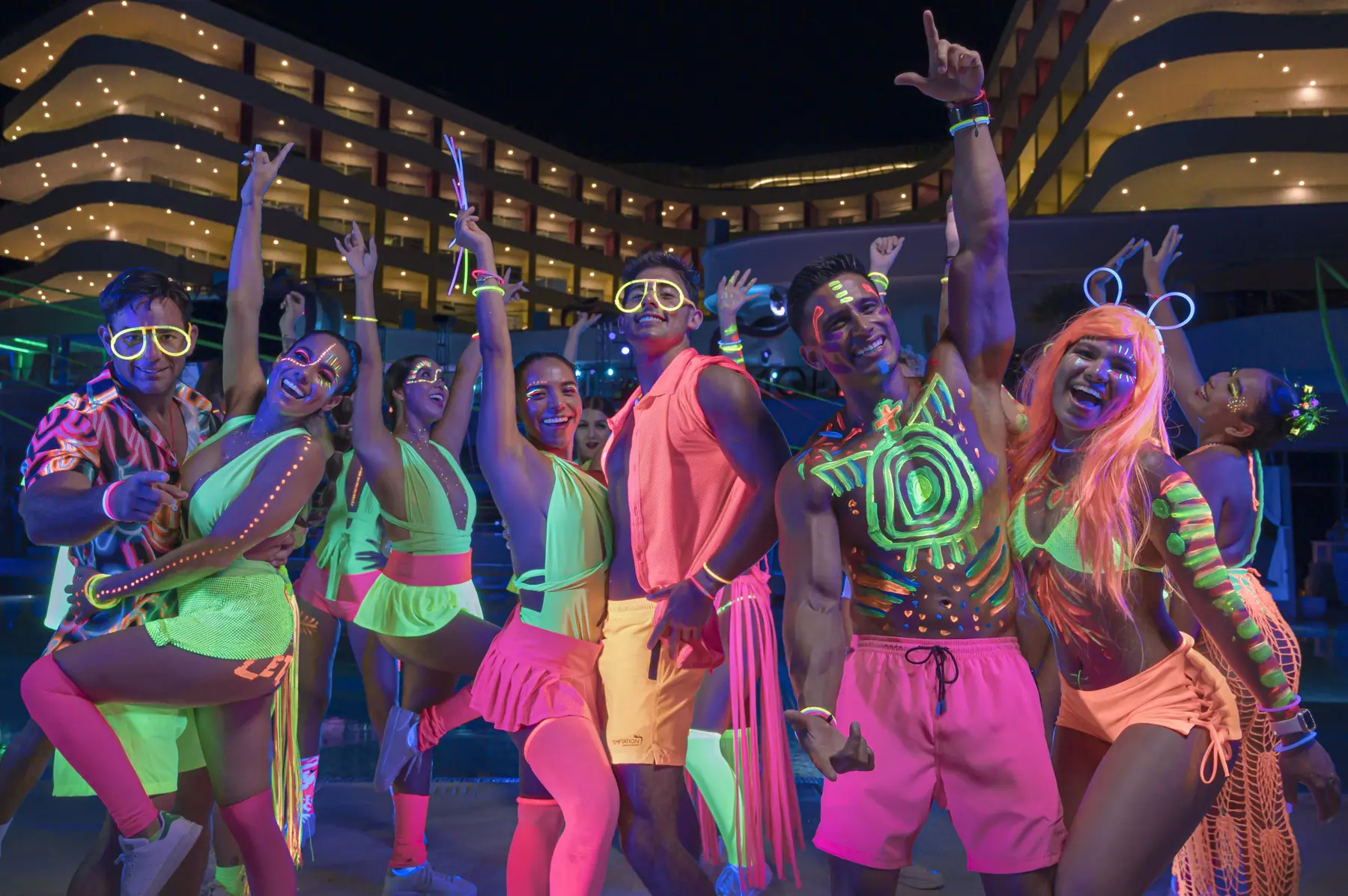 Guests dressed for a glow theme night at Temptation Cancun